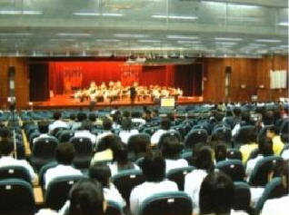 students listen to music in the auditorium